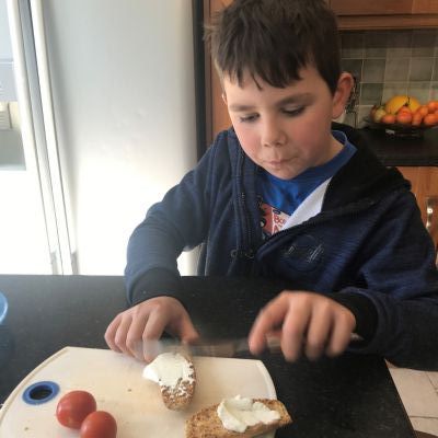 Jamie spreading cream cheese